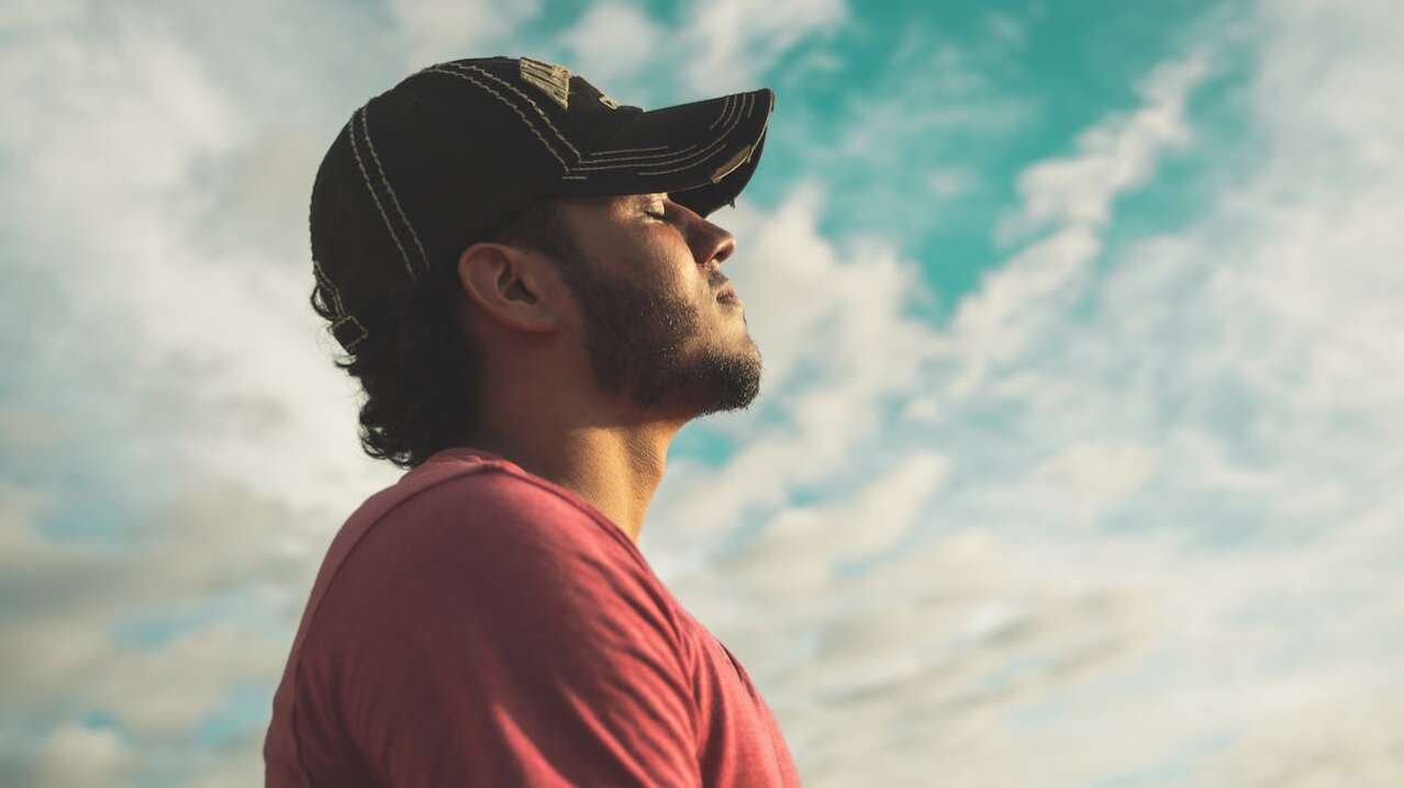 man taking a deep breath